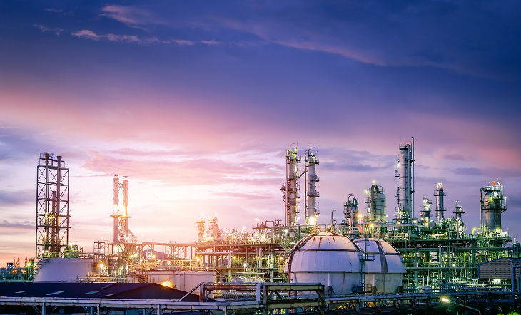 Oil and gas refinery plant or petrochemical industry on sky sunset background, Factory with evening, Gas storage sphere tank in petrochemical industrial