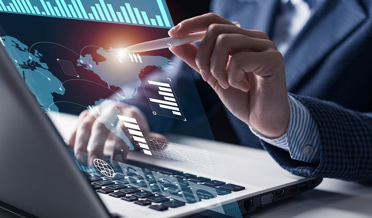 Businessman works with financial data. Futuristic 3d interface above laptop computer. Interactive financial diagrams and digital data visualization concept. Global e-business network communication; Shutterstock ID 1594085914; purchase_order: BOT; job: ; c