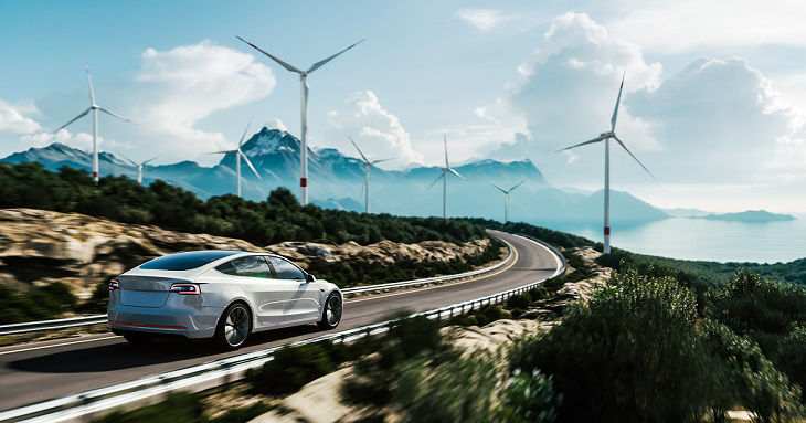 Electric car drive on the wind turbines background. Car drives along a mountain road. Electric car driving along windmills farm. Alternative energy for cars. Car and wind turbines farm. 3d render