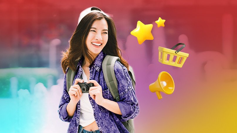 A smiling woman using her phone.