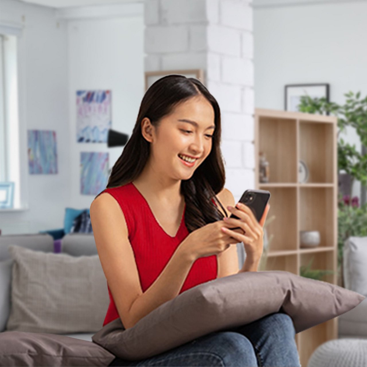 A woman holding her phone and card.