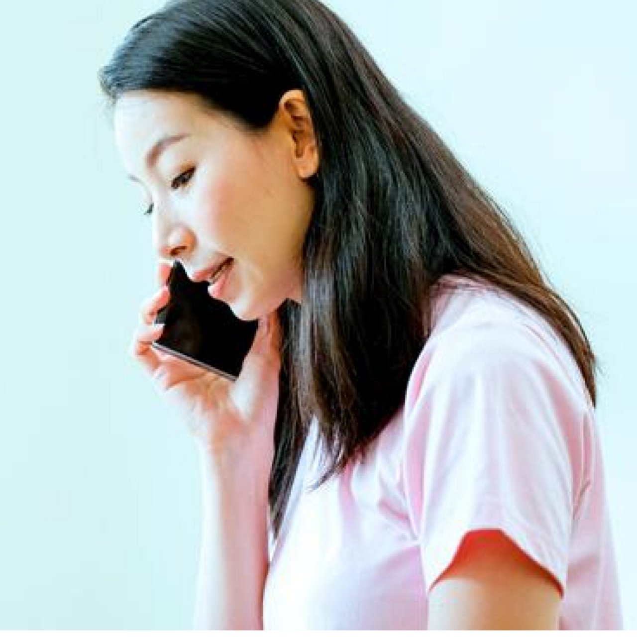 A woman calling using her smartphone.