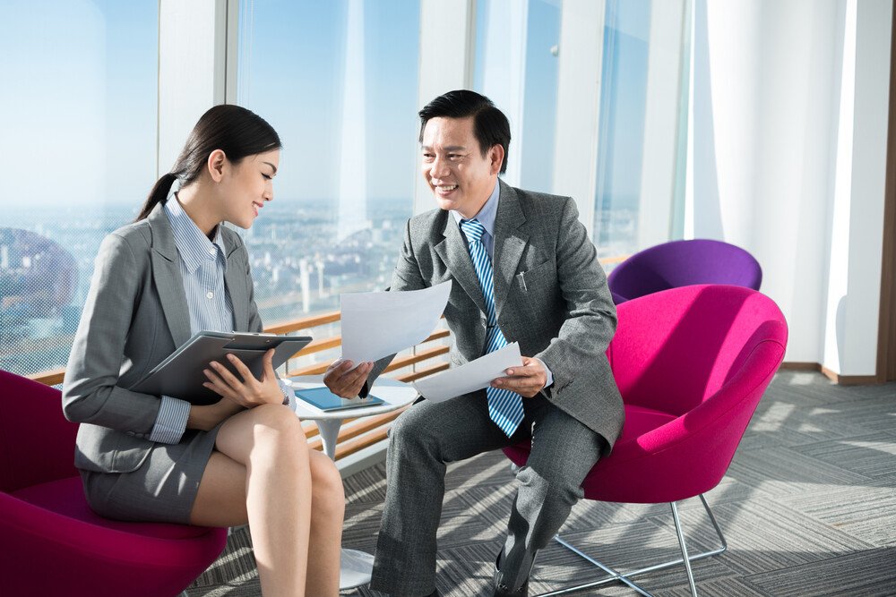People in business suits, shaking hands