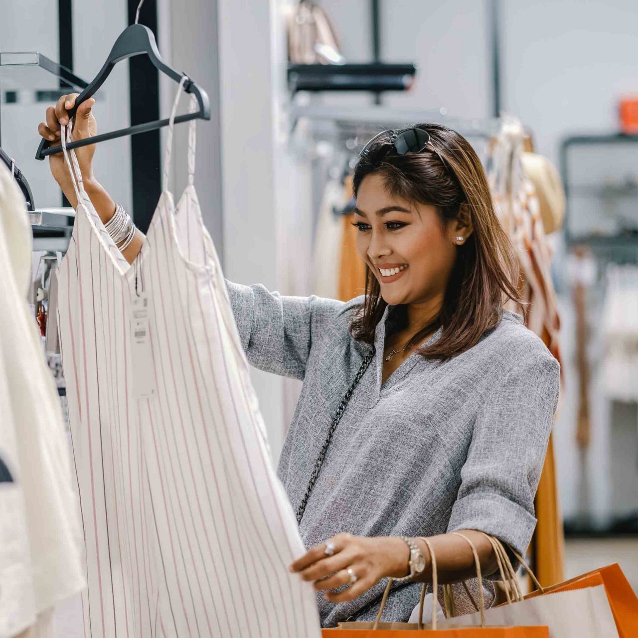 Woman checking out white dress