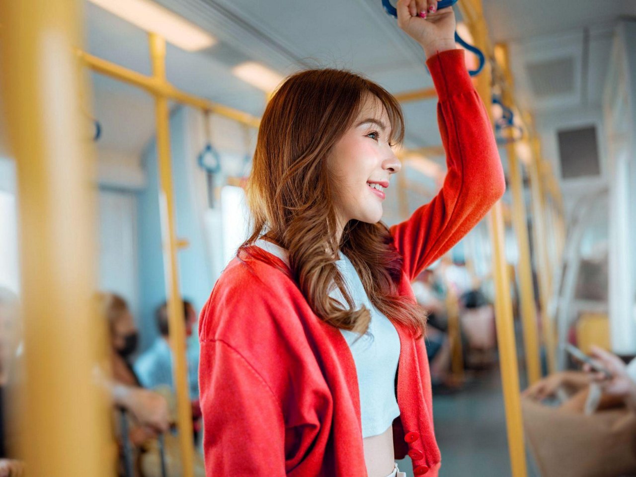 A woman holding her phone and card.