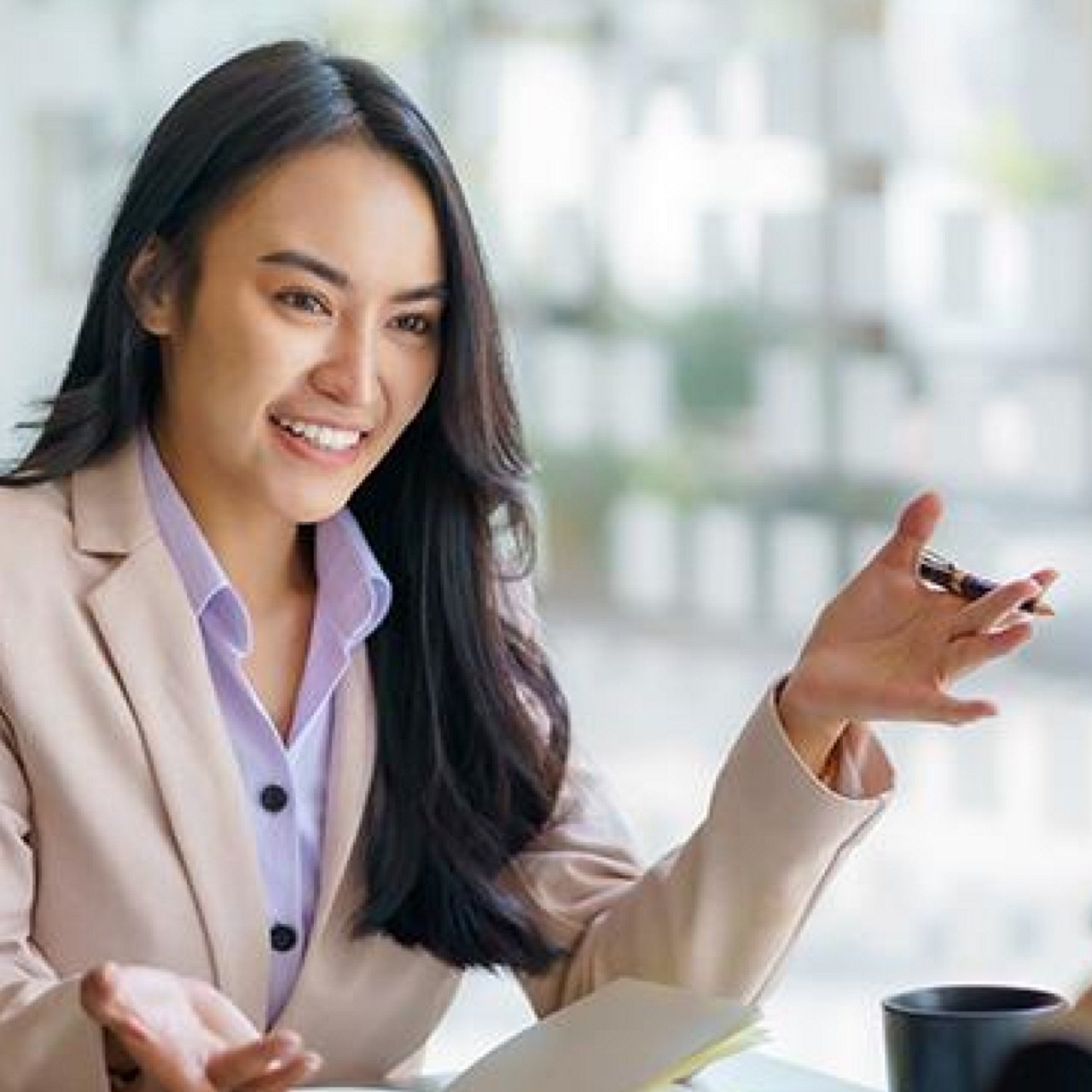A woman talking to her colleague.