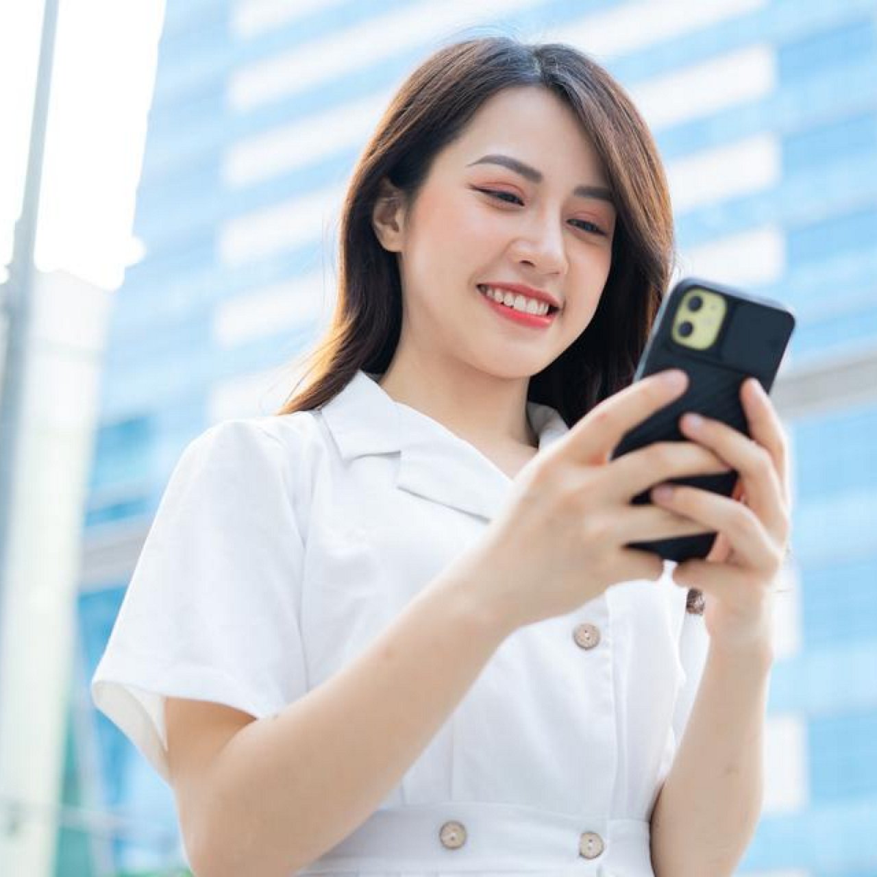 Woman having a trip outdoors with her mobile phone