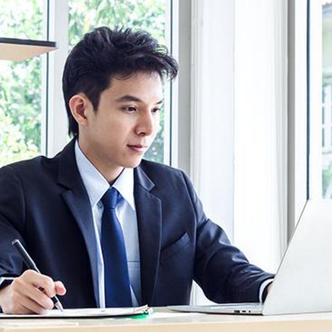 A man working on his laptop.