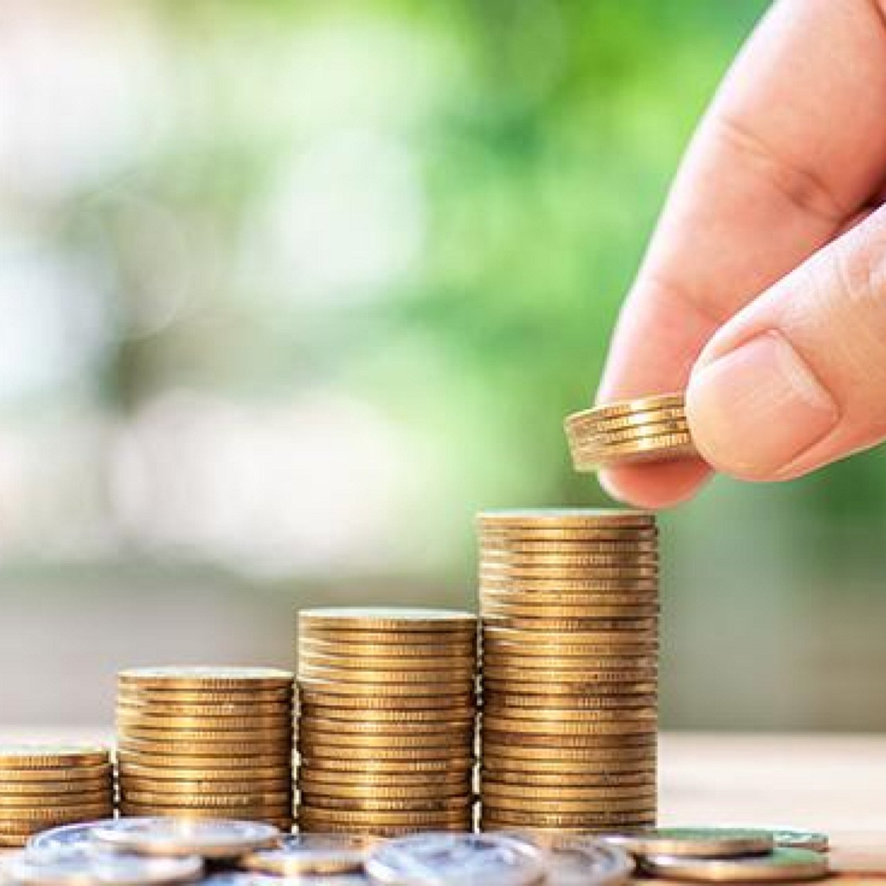 A man stacking coins.