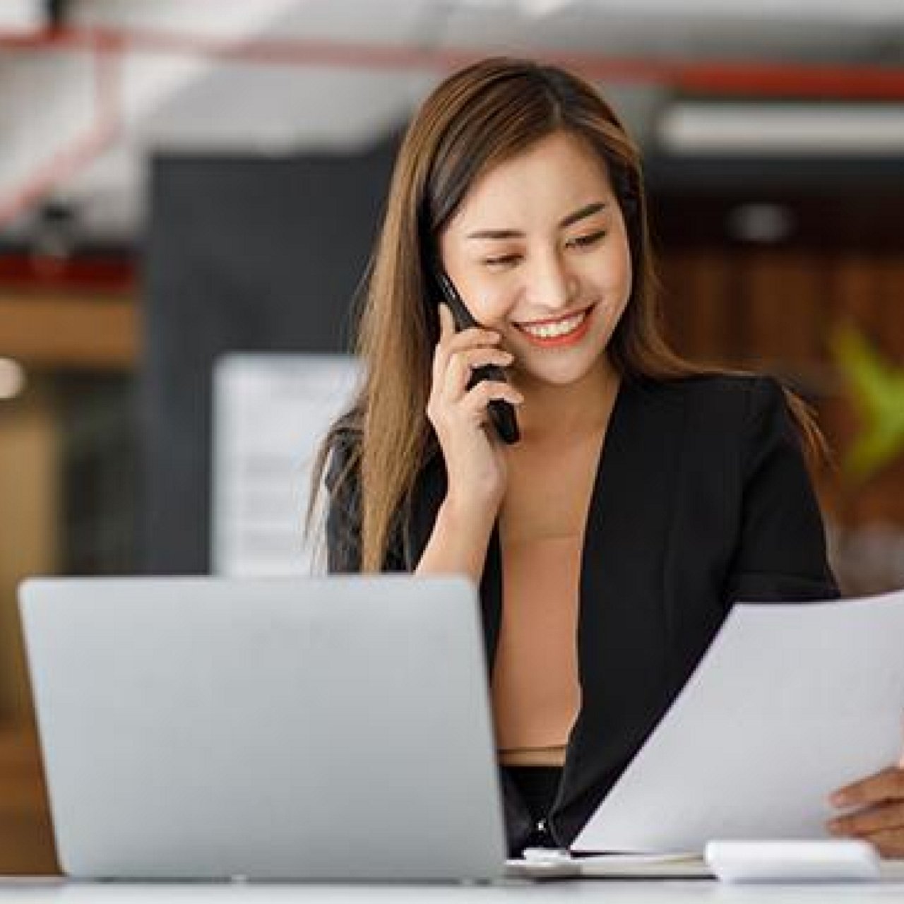 A woman talking to her colleague.