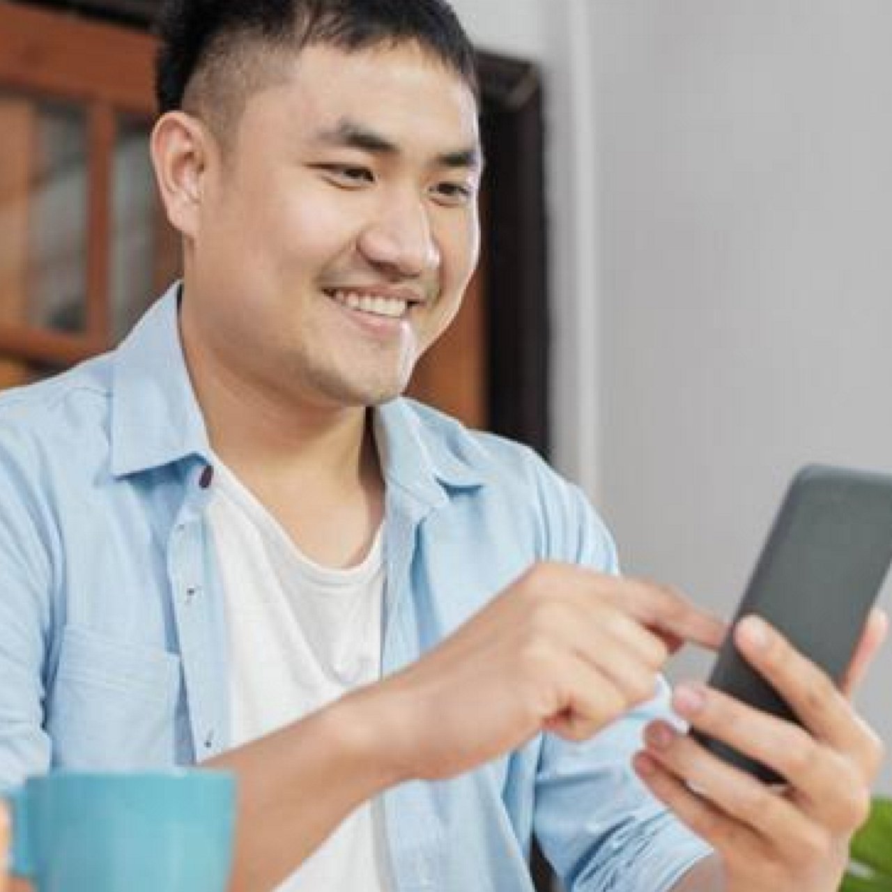 A man sending cash using his mobile phone