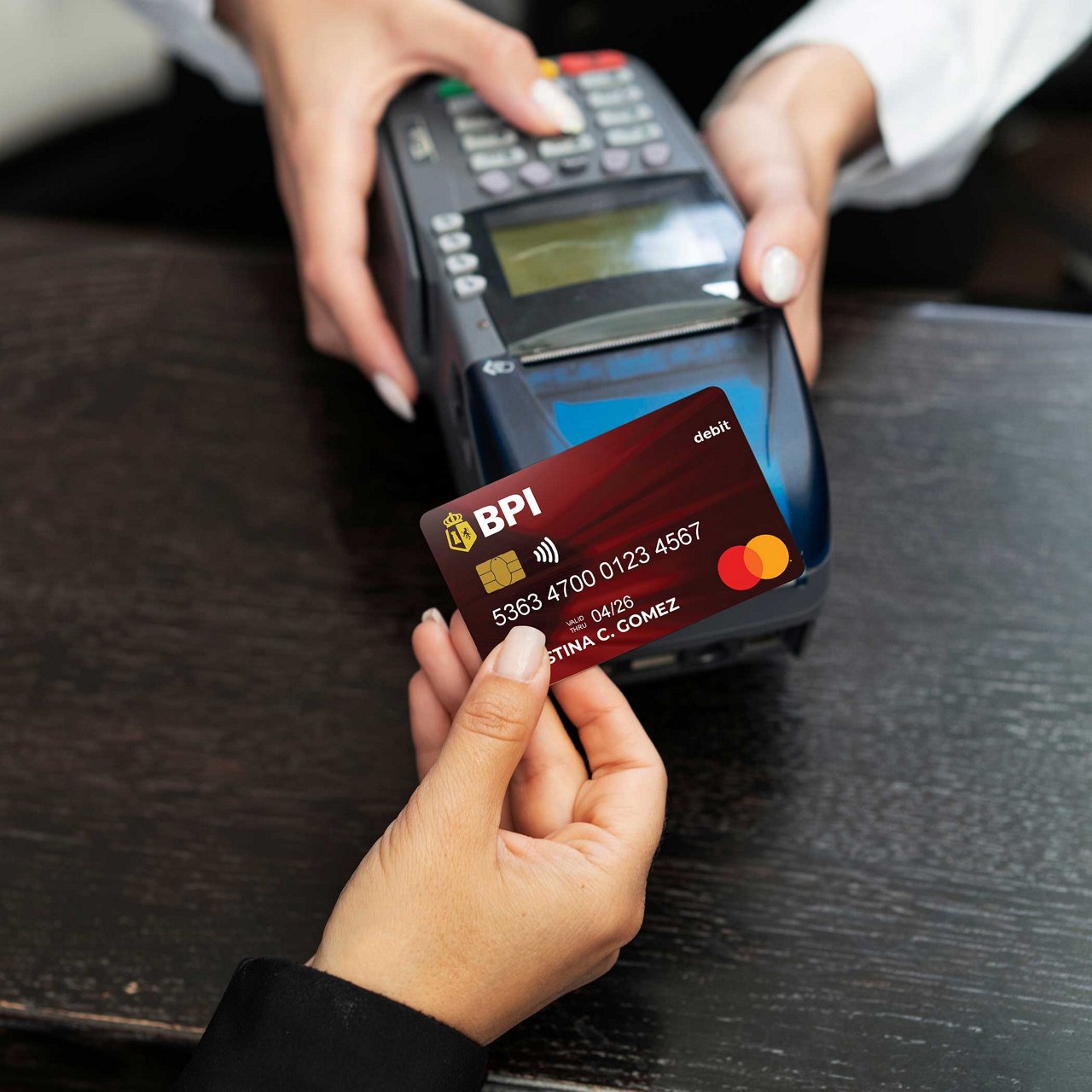 A woman holding her card.