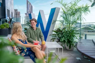 Couple enjoying a cocktail at the Wet Deck at W Brisbane | Best Brisbane accommodation