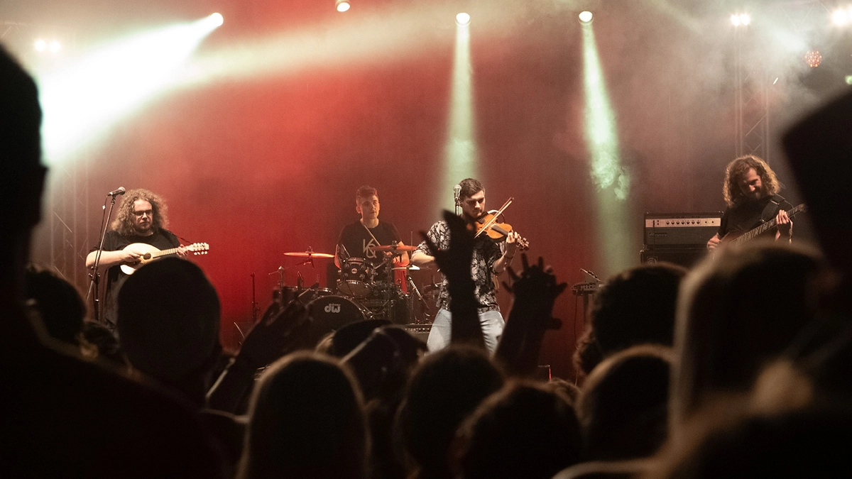 A band performing on stage A band performing on stage