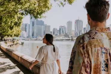 Couple at South Bank Parklands Brisbane River | sustainable city break in Brisbane 