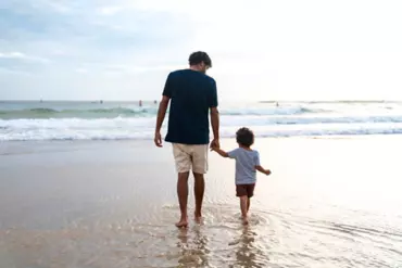 Father and son at Burleigh Beach for sunrise