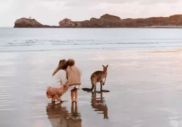 Mother and daughter with a wallaby at sunrise Cape Hillsborough | accessible travel Mackay