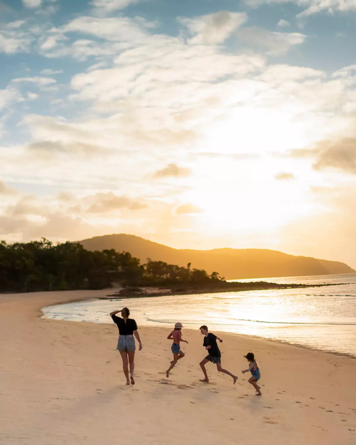 Family walking along the beach at sunset, Punsand Bay Cape York | beautiful beaches Queensland Family walking along the beach at sunset, Punsand Bay Cape York | beautiful beaches Queensland