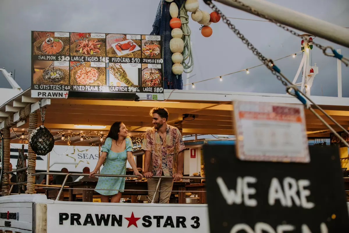Couple at Prawn Star, Fresh seafood off the trawlers | Free things to do Cairns