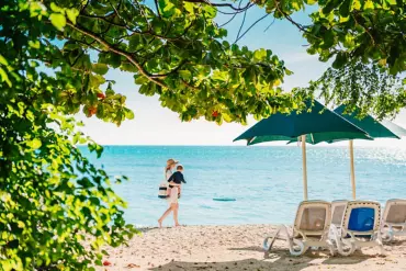 Mother and child on the beach at Green Island | Cairns 7-day itinerary for families Mother and child on the beach at Green Island | Cairns 7-day itinerary for families