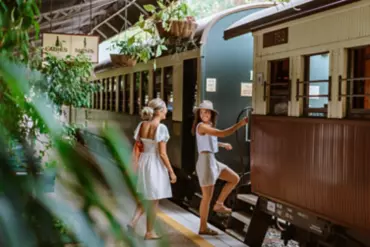 Two ladies boarding the Kuranda Scenic Railway at Kuranda Station
