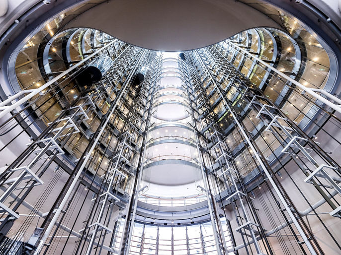 Interior image of 1 Bligh office space exposed elevator shafts within large void 