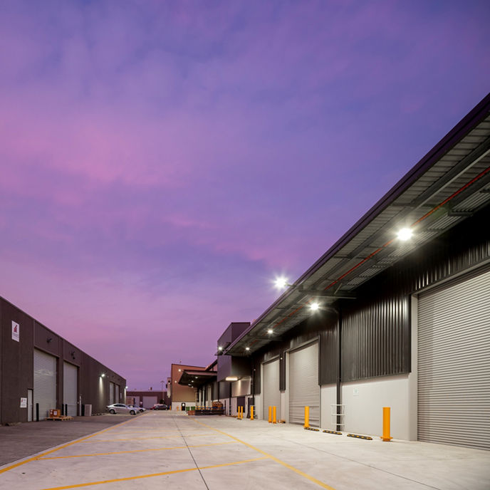 Exterior image of Botany Quarter Industrial Estate warehouse roller doors at sunrise