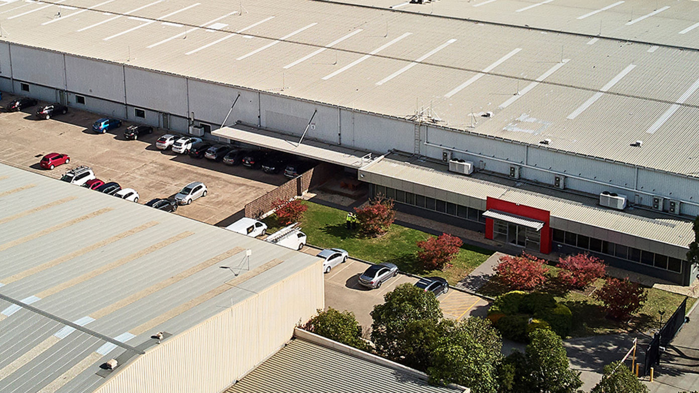 Aerial image of industrial estate with car parking
