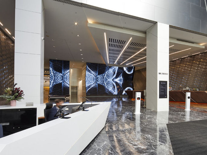 Image of lobby concierge and digital artwork at 180 Lonsdale Street 