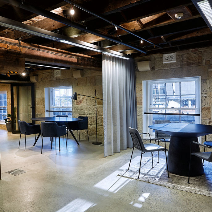 Image of workspace with original sandstone walls and views to Barangaroo