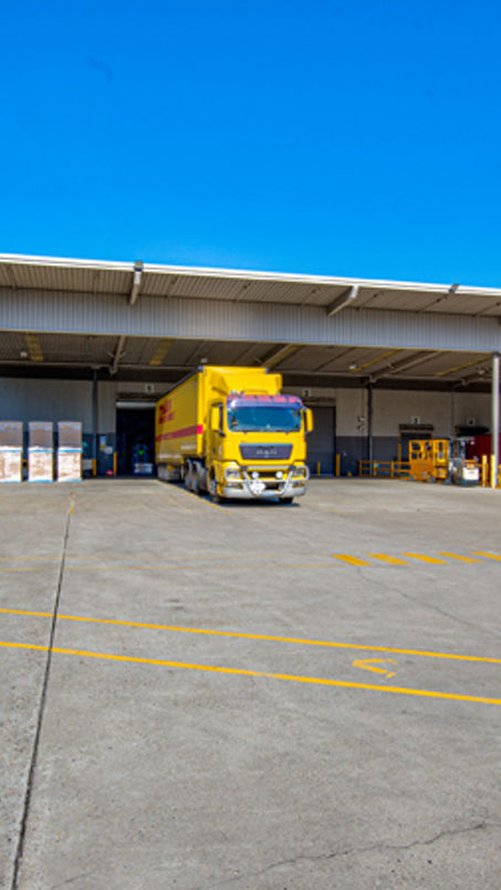 Exterior image of 52 Holbeche Road distribution centre loading dock with DHL overhead signage