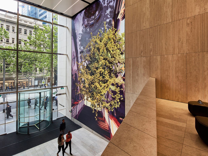 person walking through 80 Collins Street South Tower lobby