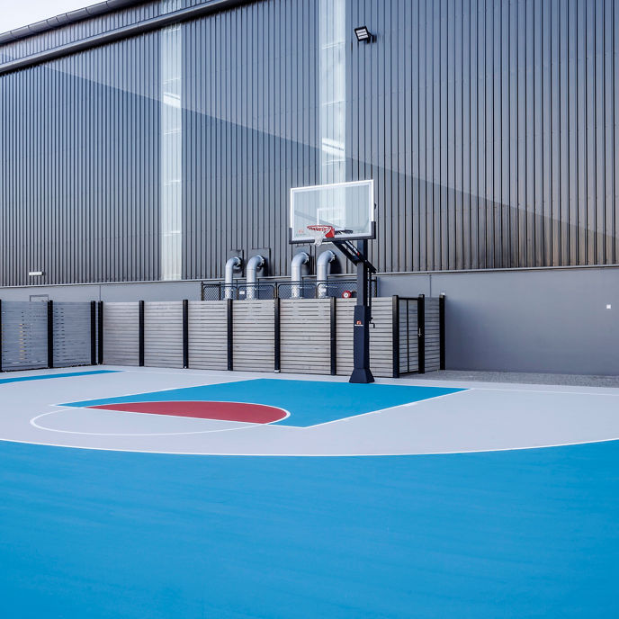 Outdoor basketball court at an industrial estate