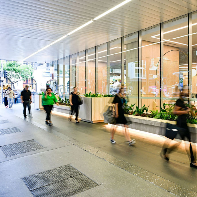 Exterior image of 123 Albert Street looking in at ground floor lobby with pedestrians walking past 