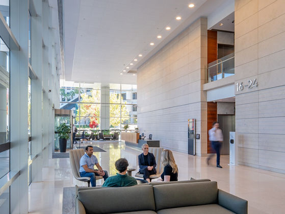 Image of people sitting and talking in lobby at 240 St Georges Terrace