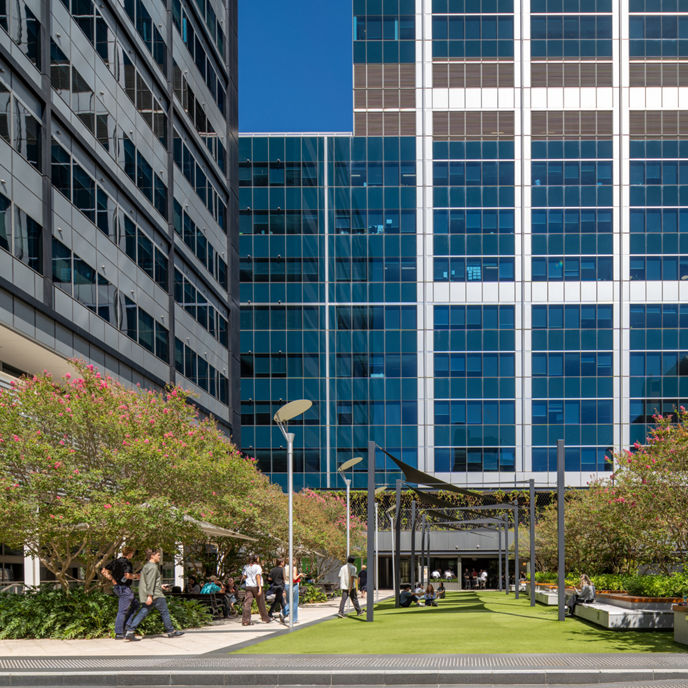 Image of people enjoying grassy outdoor amenity at 240 St Georges Terrace