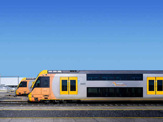 Two Sydney trains parked at a train yard 