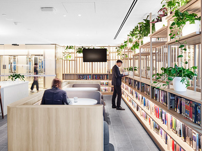 Image of person walking up to concierge desk at One Eagle