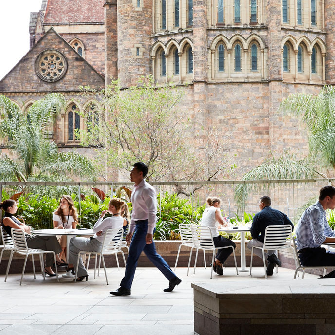 People sat on the outdoor terrace at 480 Queen Street, Brisbane