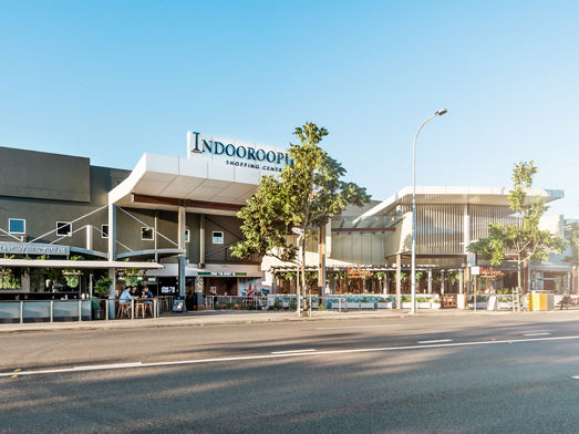 The front of Indooroopilly Shopping Centre with cafes and restaurants out front 