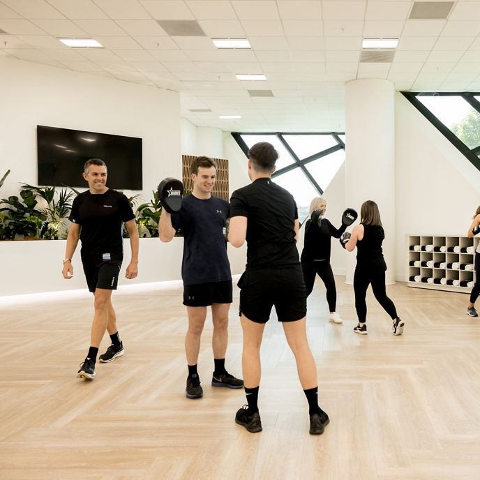 Image of boxing class in The Studio wellness facility at One Eagle