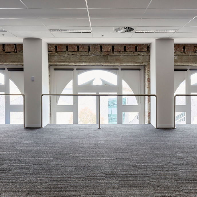 Internal workspace image looking out through heritage windows and facade