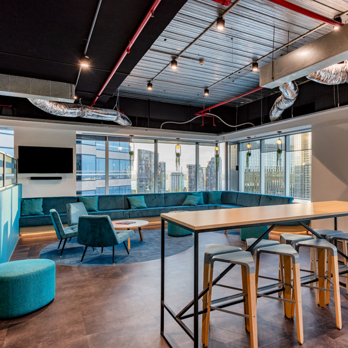 Interior image of Alluvion office facilities large breakout area couches with expansive view of Swan River in Perth 