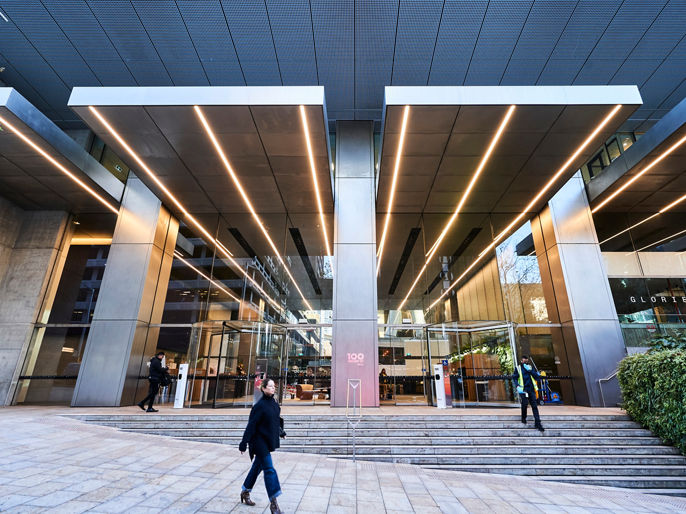 Wide angle exterior image of 100 Mount Street office tower from street level 