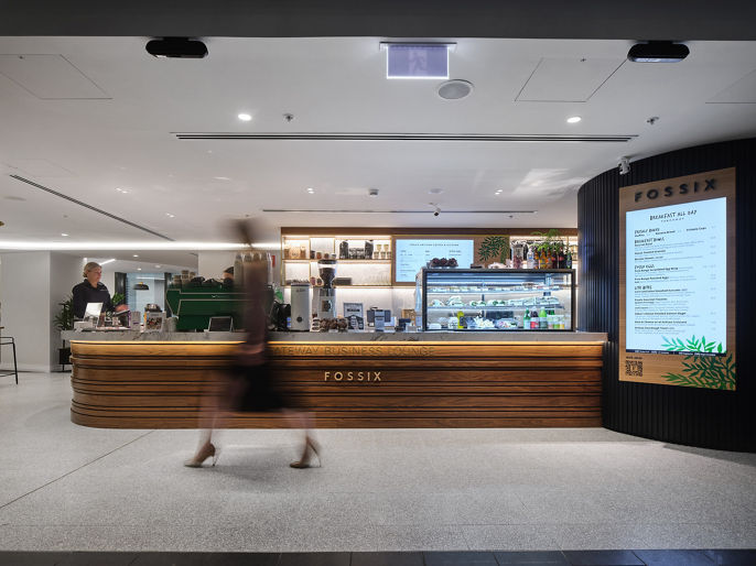 A person walking past the Fossix cafe counter at Gateway