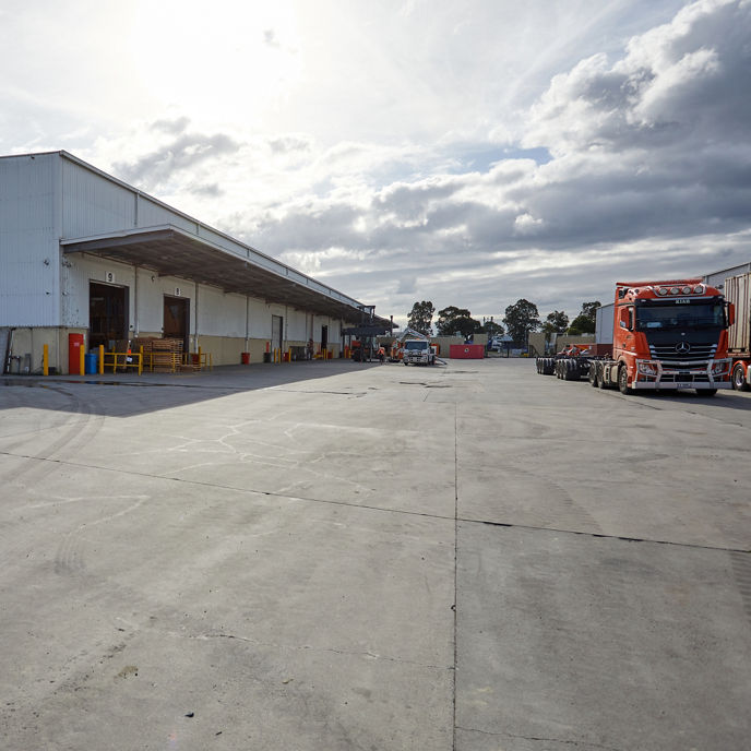 External image of 202-228 Greens Road loading dock facilities with skip bins and trucks