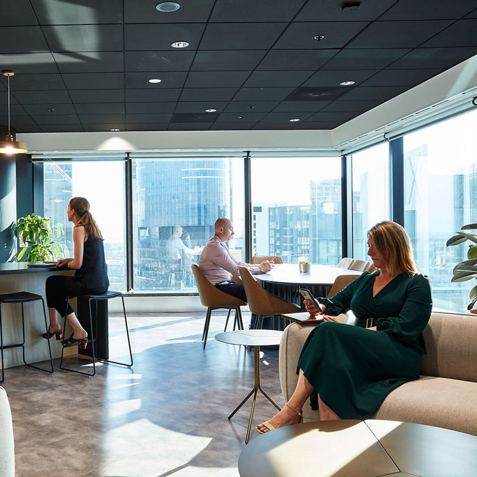 Image of staff in kitchen and breakout area in a One Eagle workspace 