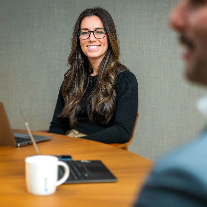 Woman smiling in a meeting 