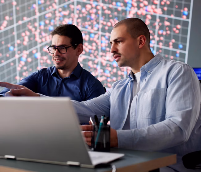 Man in cyber data team monitoring computer technology in office.   Possible professions: programmer, security monitor, software engineer, network developer.