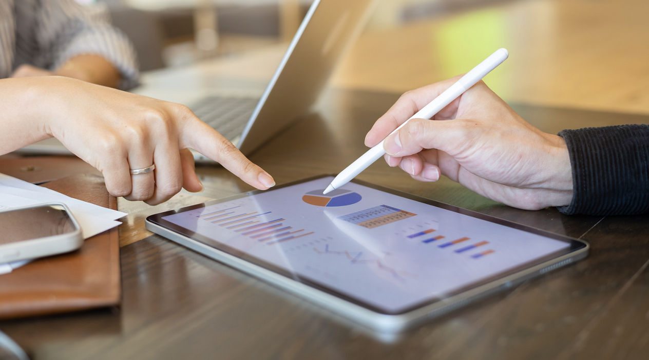 close up ceo businessman hand use stylus pen to point on dashboard screen tablet device for ask and share idea or consulting with businesswoman partner for business teamwork concept